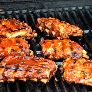 ribs on the grill with bbq sauce