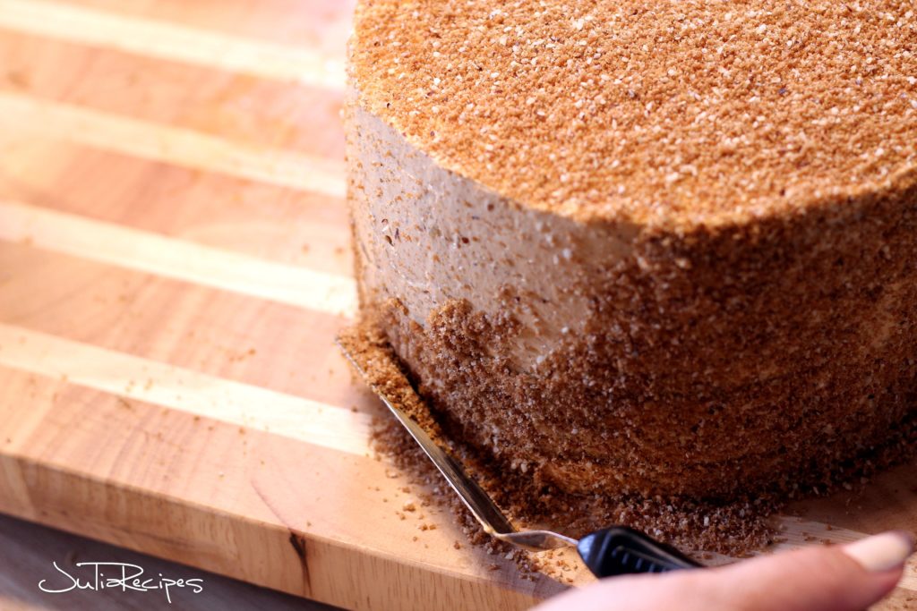 covering cake with ground walnuts