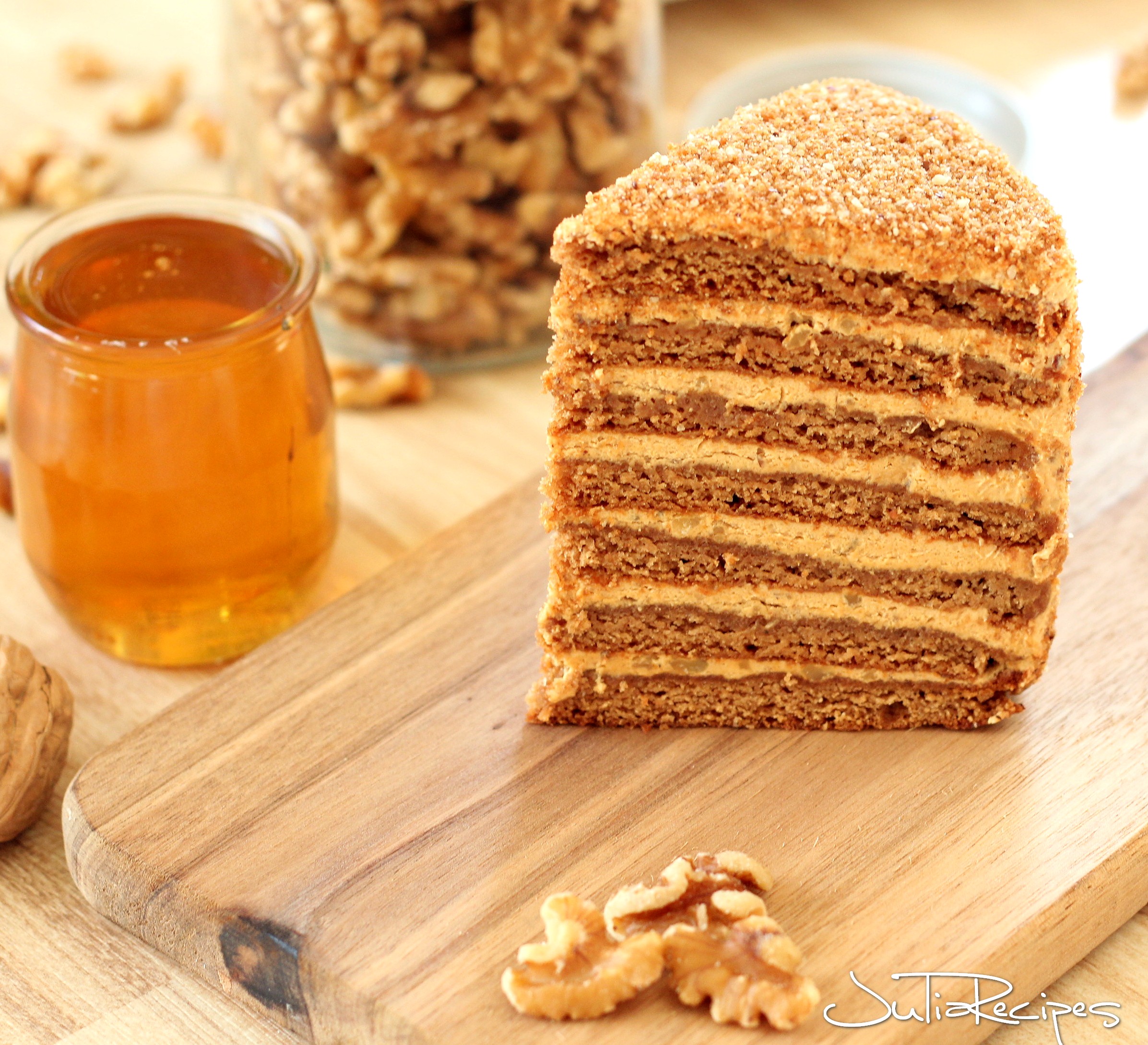 cake with dulce de leche layers on wodden board