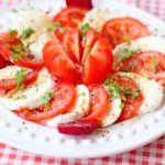 Caprese salad with sliced tomatoes and mozzarela
