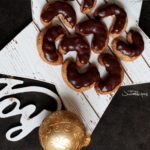 cookies in crescent shape on white star board