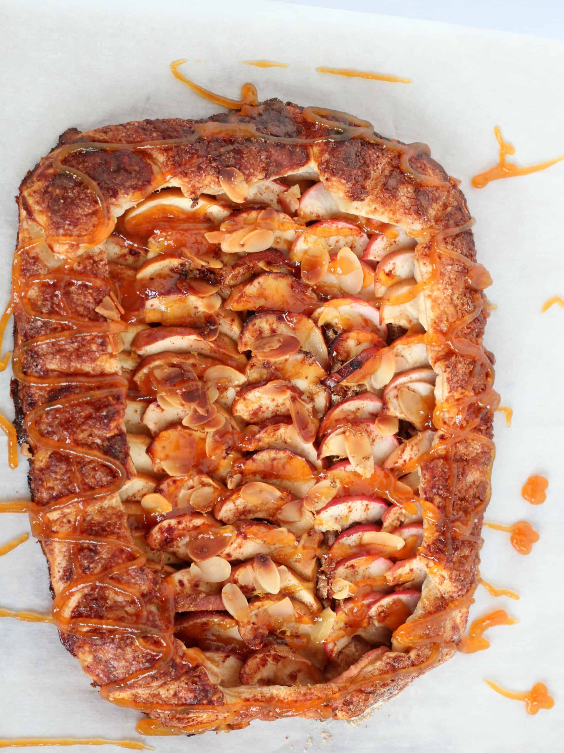whole puff pastry apple galette drizzeled with caramel sauce