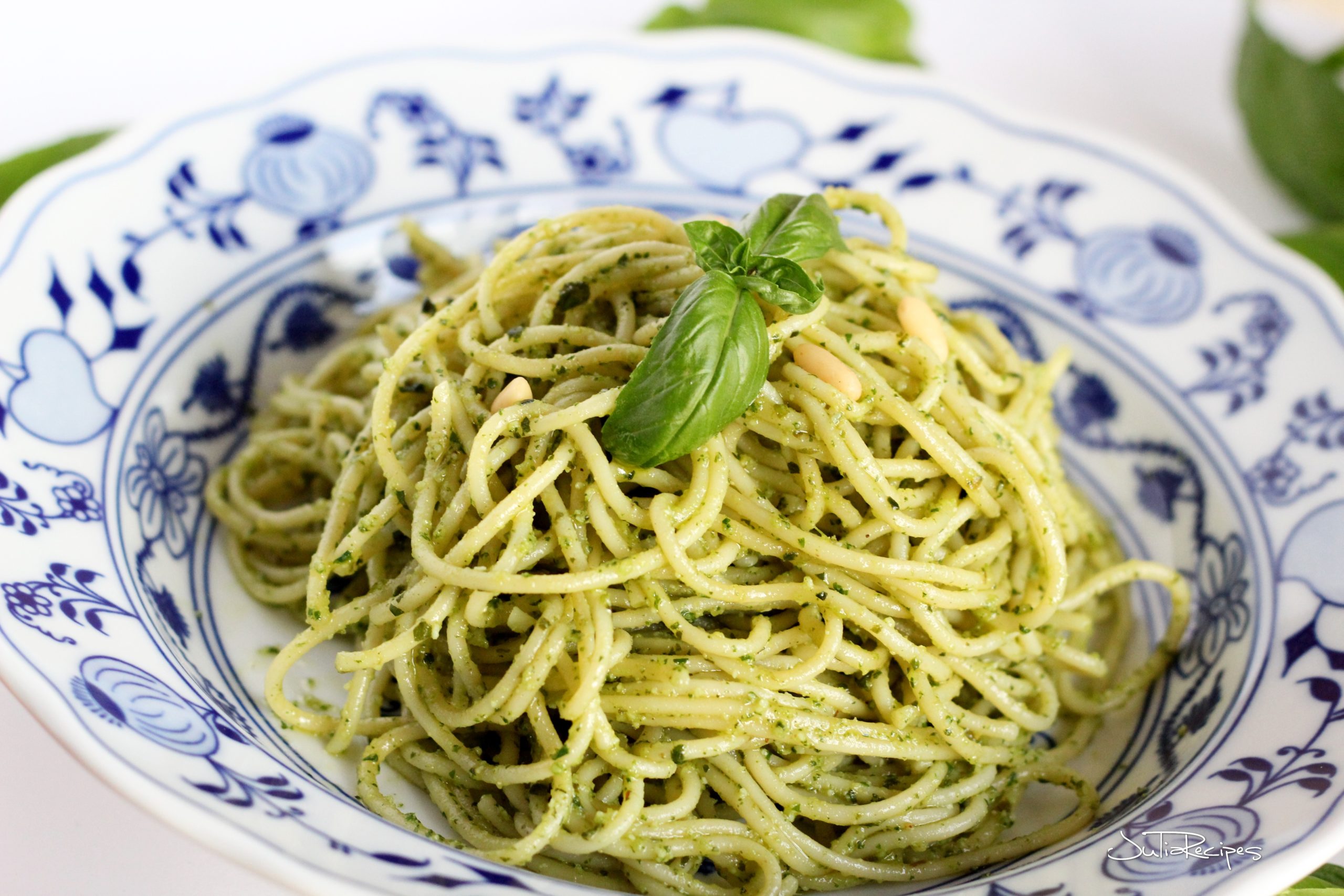 spaghetti with basil pesto on plate