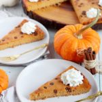 pumpkin spice cheesecake slices and place on white plates
