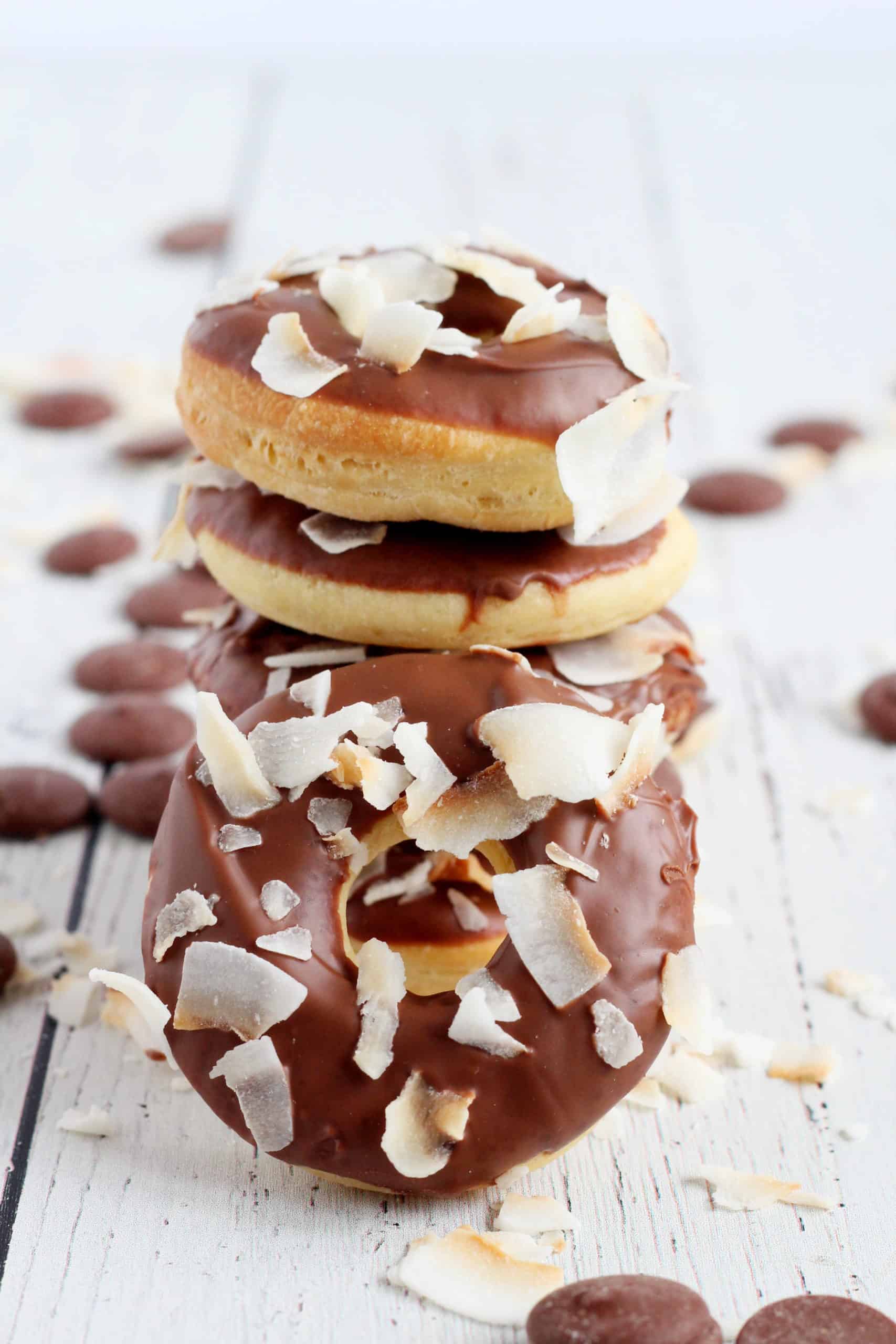 mini donuts with chocolate glazed and toasted coconut flakes