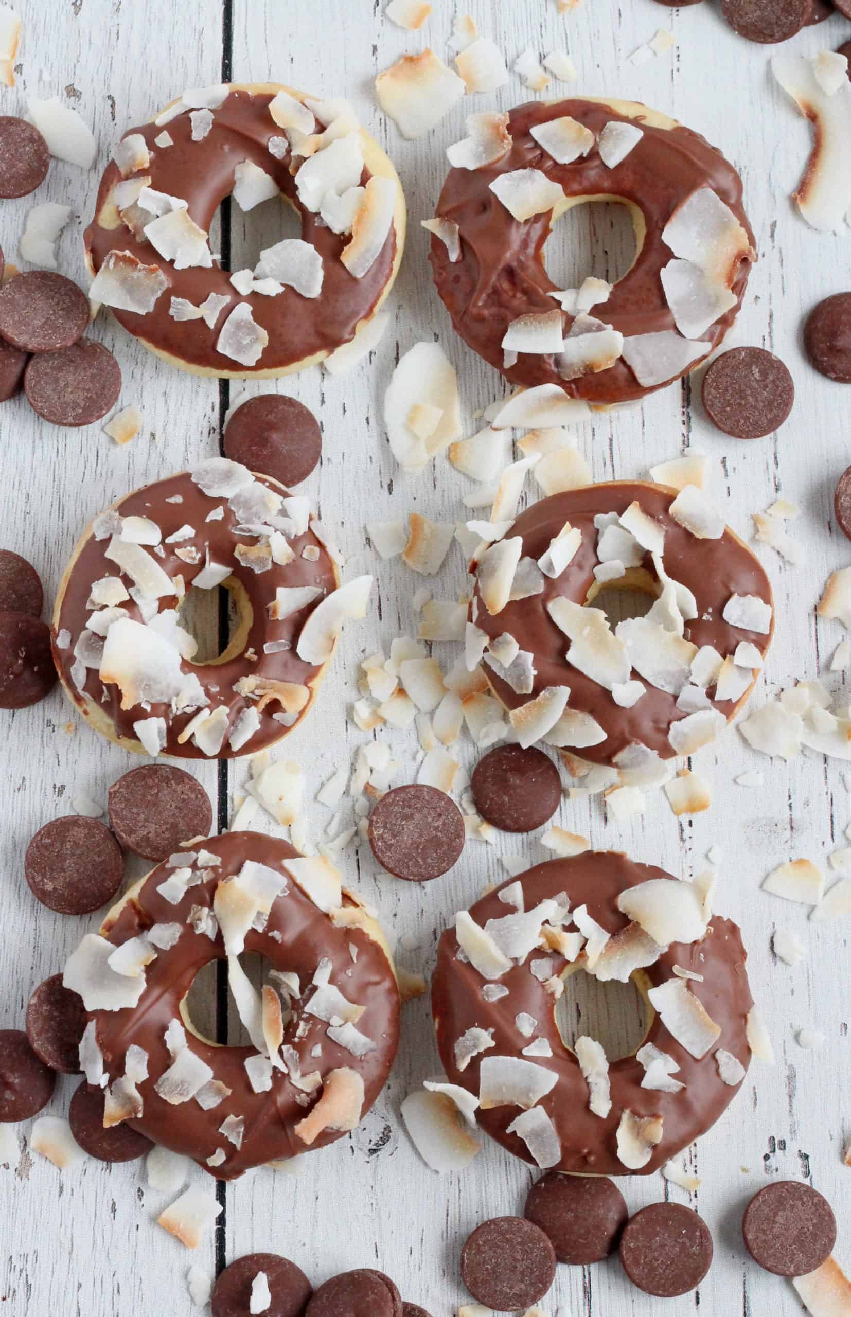 baked donut covered in chocolate and coconut flakes