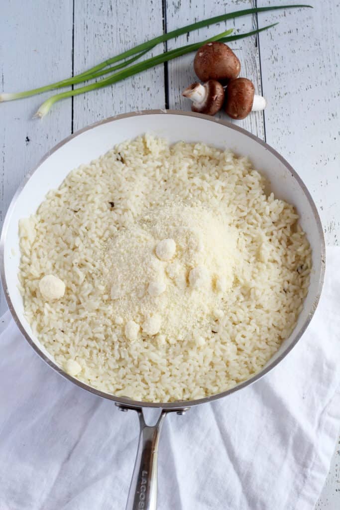 arborio rice in skillet with parmesan