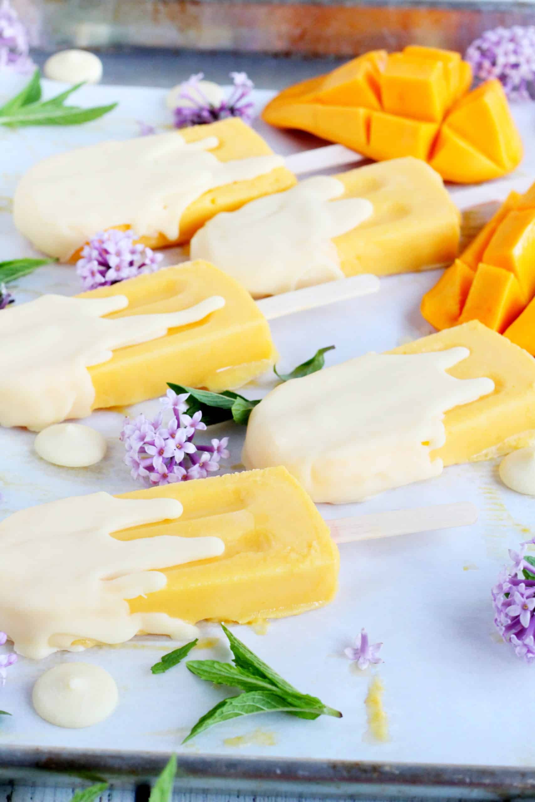 Mango pops with white chocolate cover