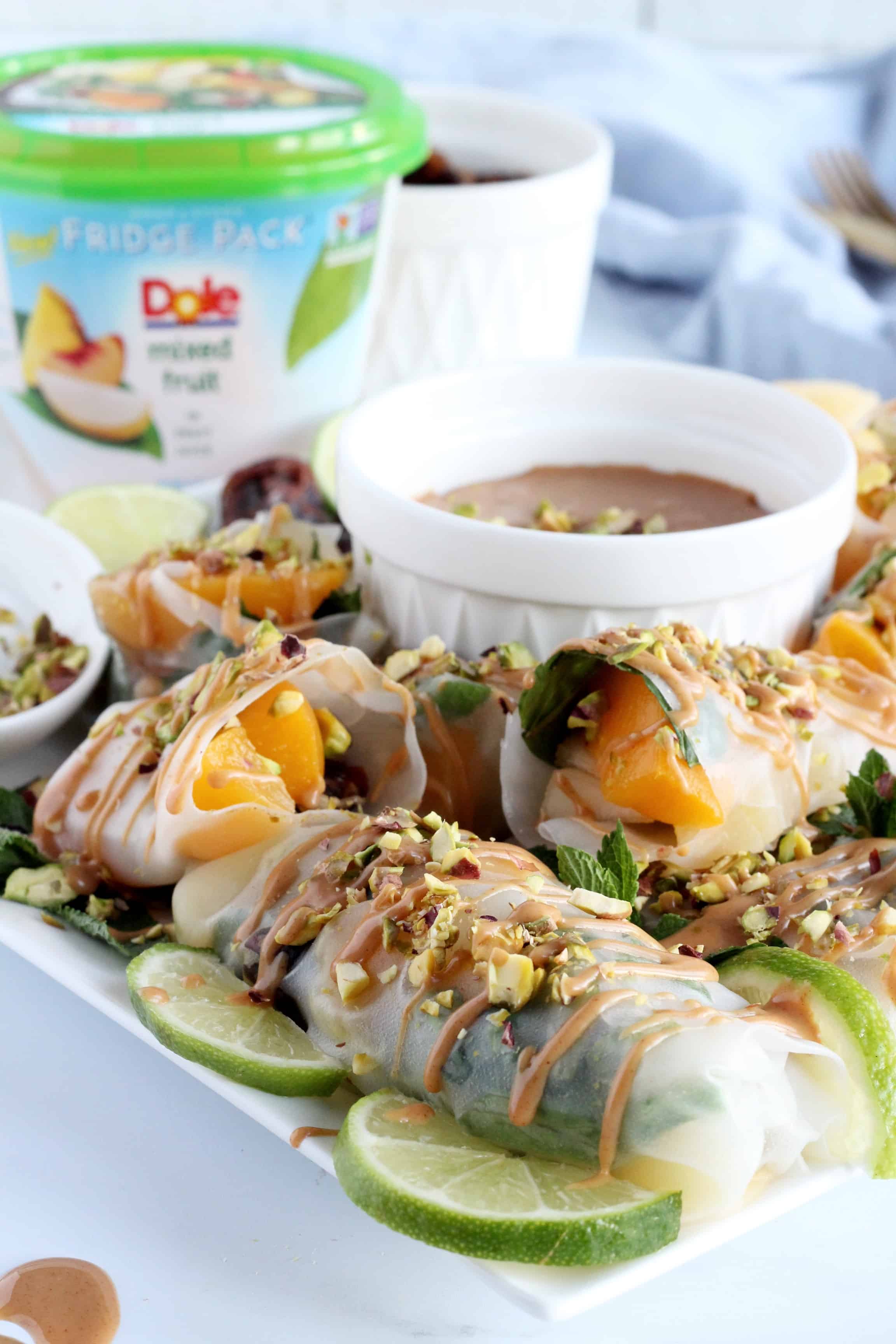Dole Mixed Fruit spring rolls drizzled with peanut butter