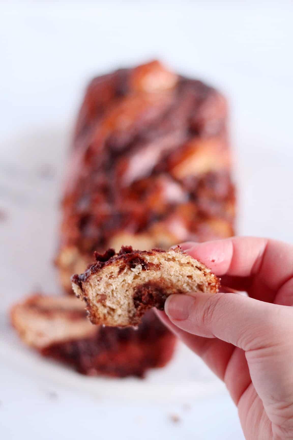 close up on piece of chocolate babka with almond filling