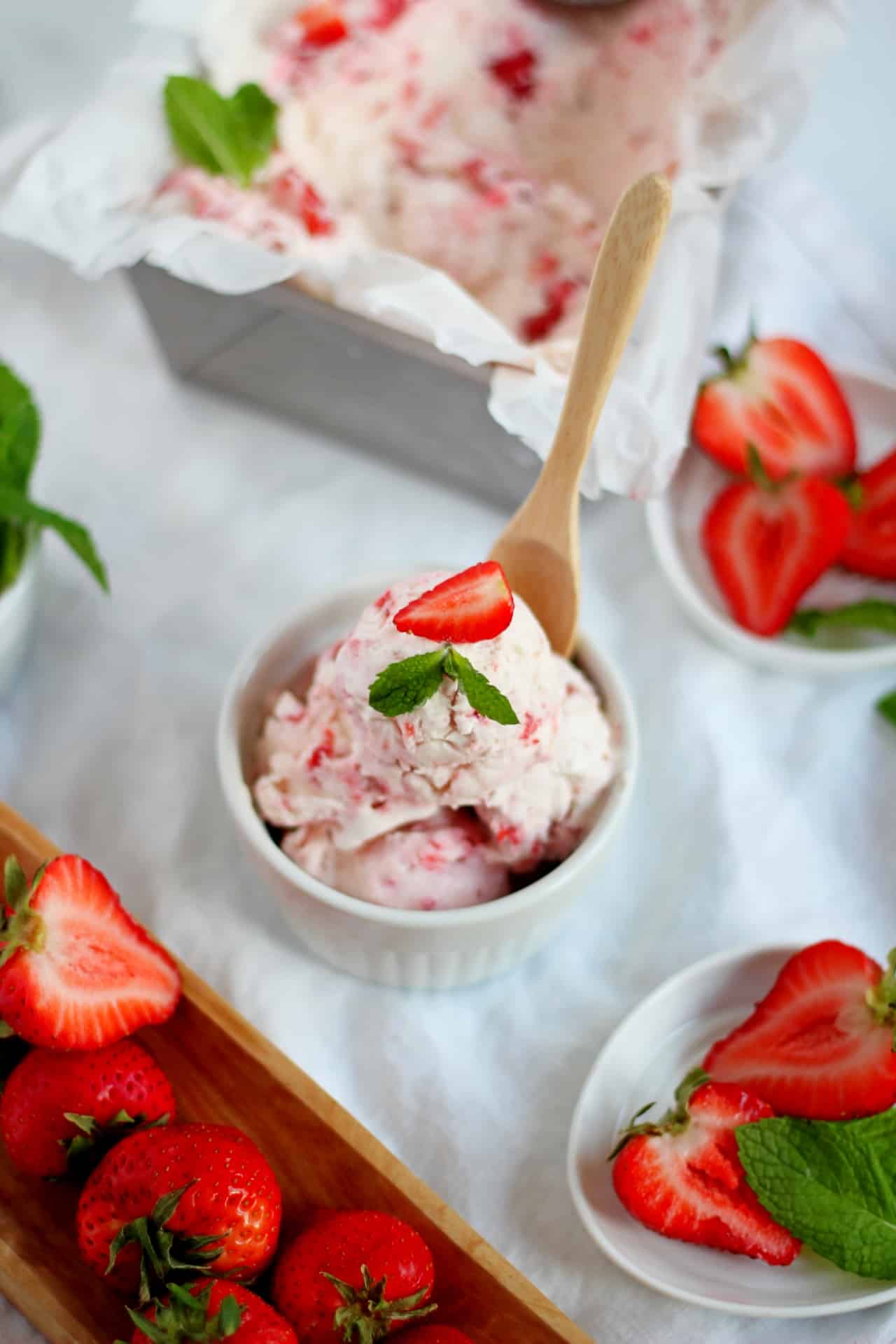 strasberry ice cream scooped in white bowl