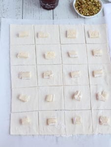 puff pastry cut in squares with brie pieces