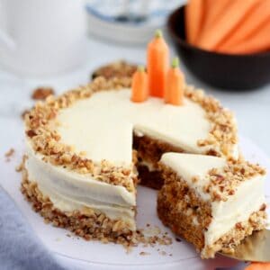 Carrot cake with cream cheese frosting and walnuts
