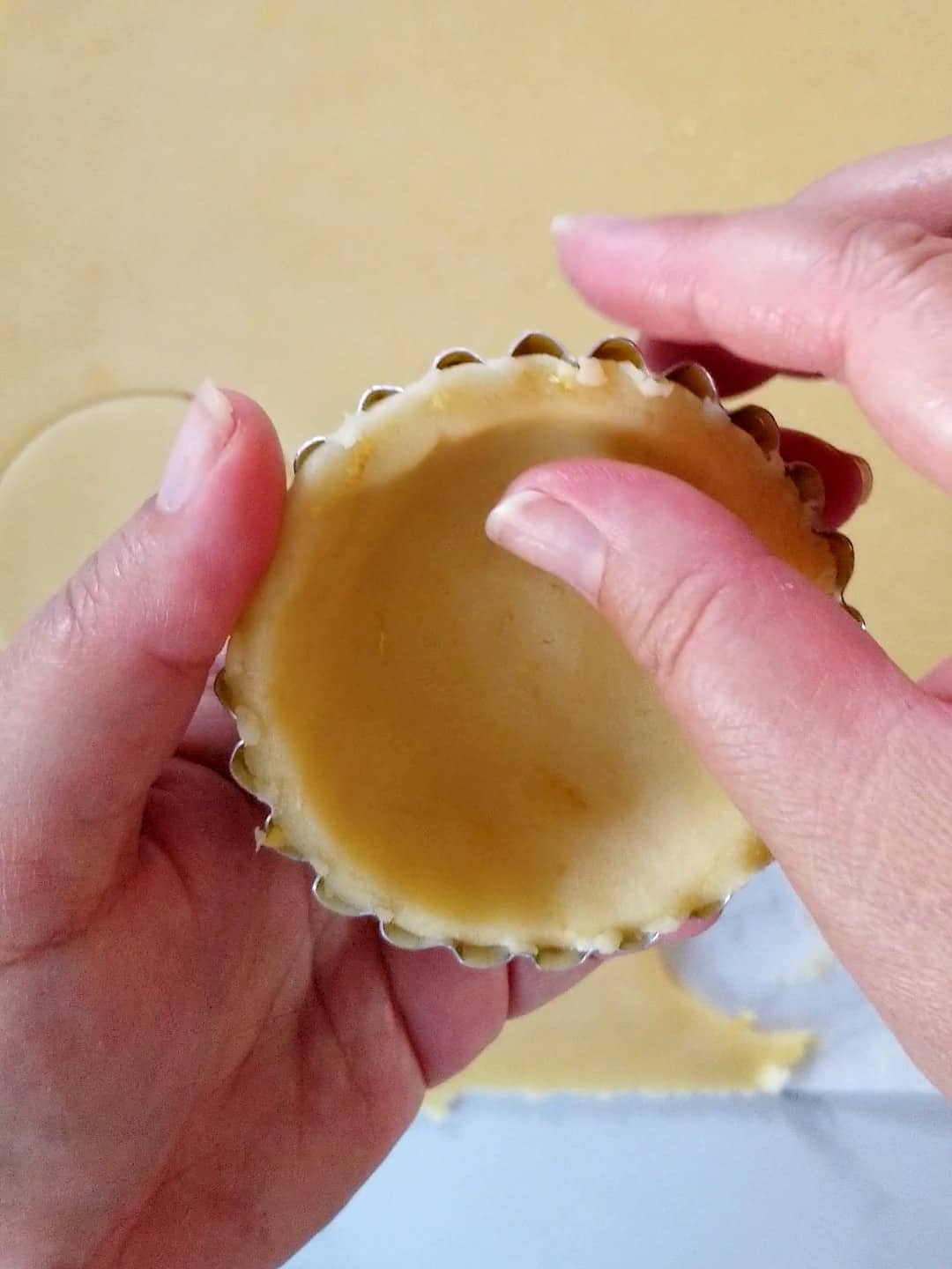 Filling mini tart shell with dough