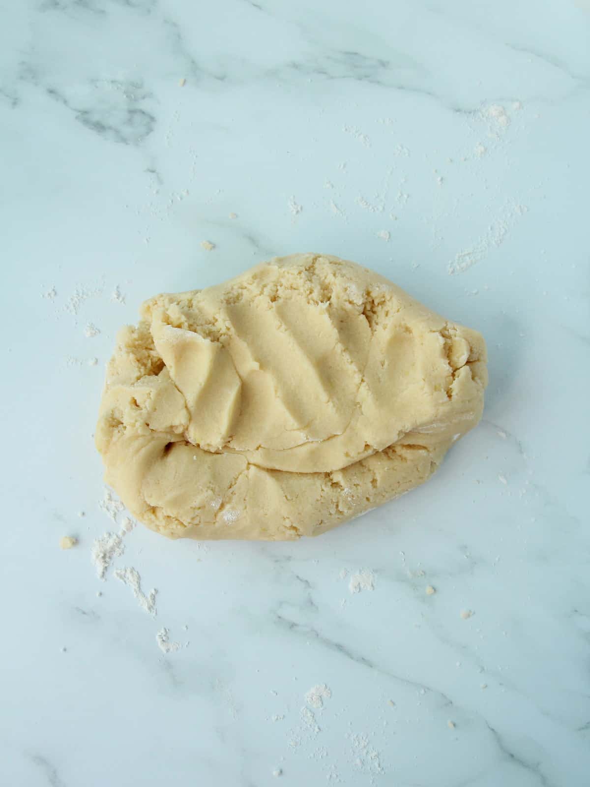 dough for tarts on marble background