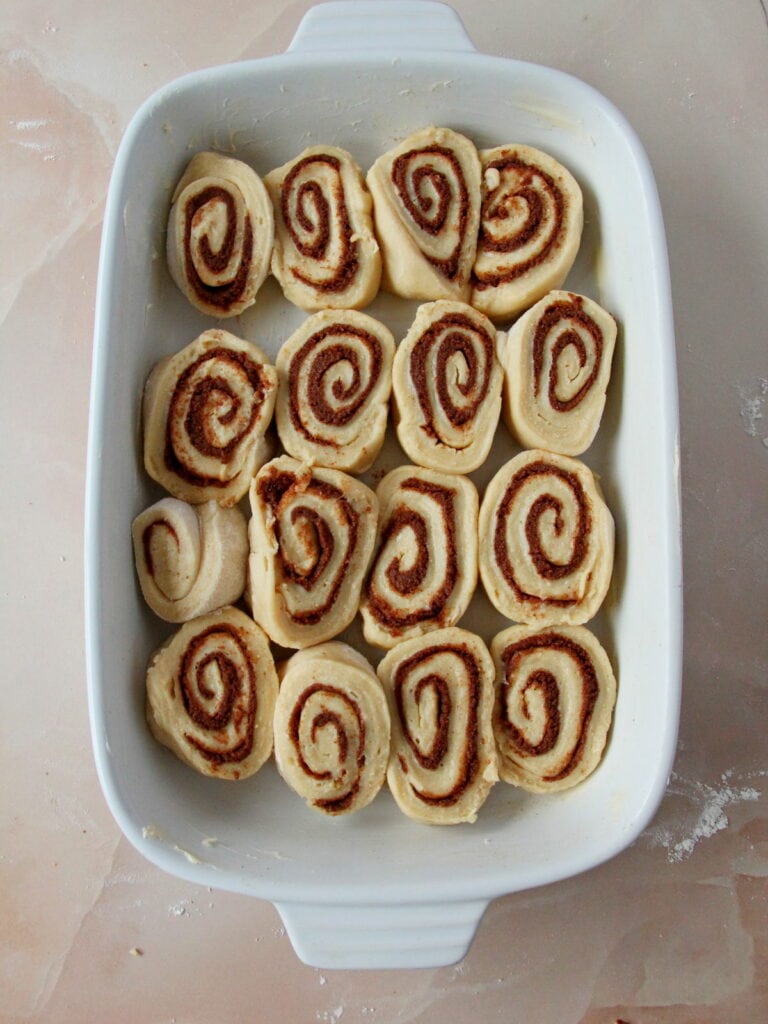Place cinnamon rolls in butter greased pan